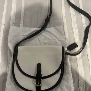 Coach white leather bag with black strap and detail